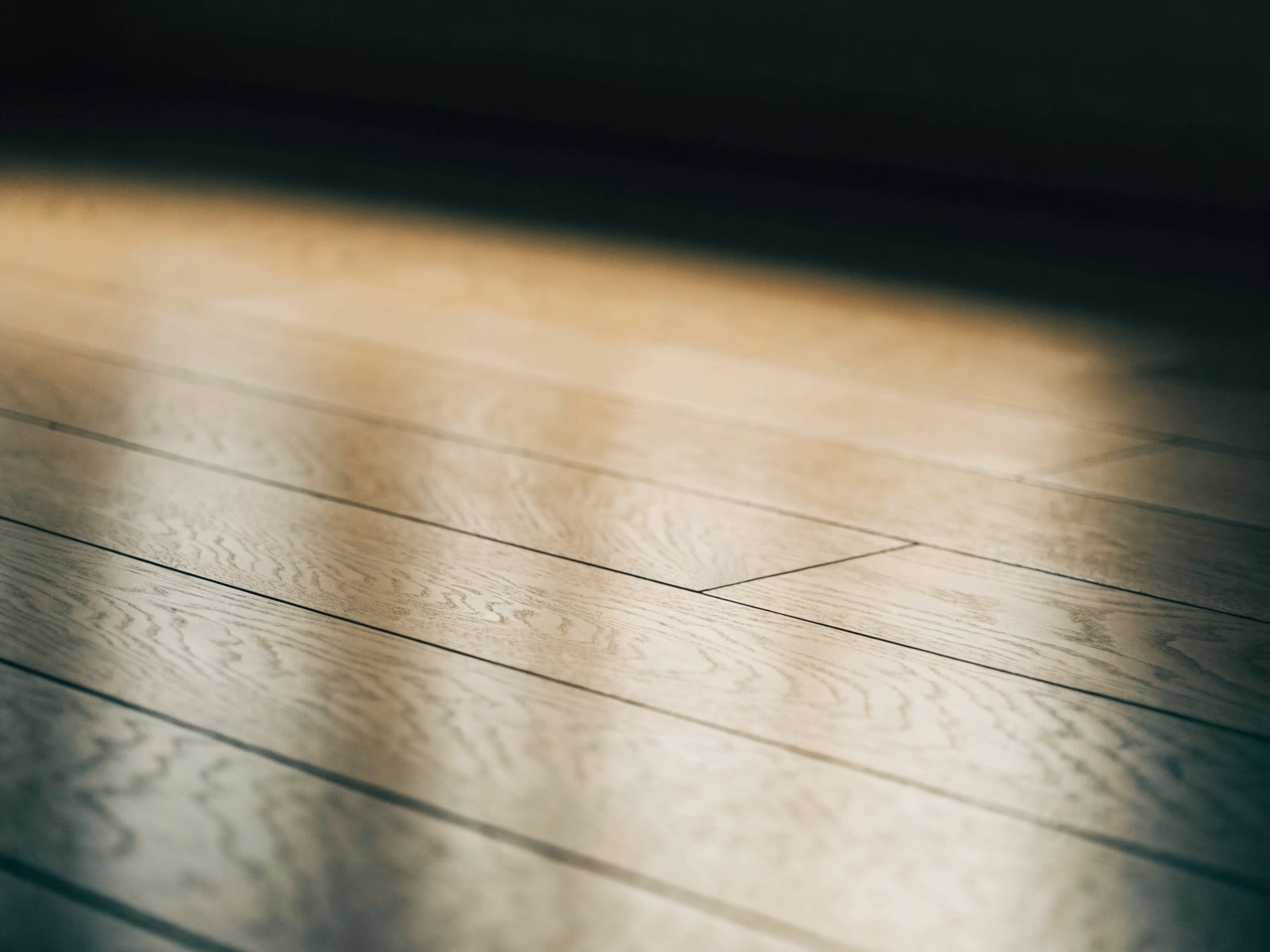 Light maple hardwood flooring with fine, subtle grain