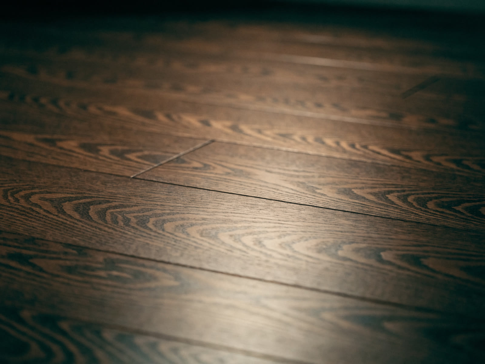 Dark American walnut hardwood flooring with flowing grain